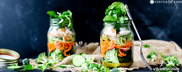 how-to-make-a-mason-jar-salad-1.jpg Freshly prepared mason jar salads lined up for meal prep