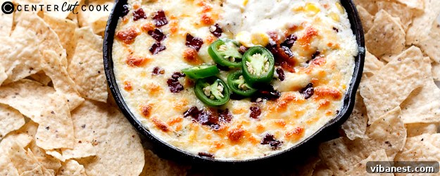 cheesy-bacon-jalapeno-corn-dip-1.jpg cheesy bacon jalapeno corn dip in a cast iron skillet
