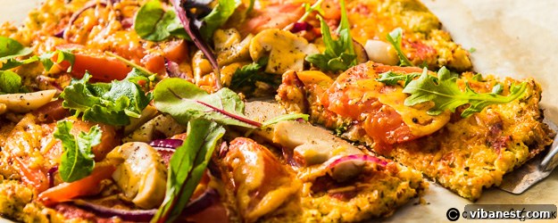 Delicious grain-free cauliflower pizza with mushrooms and melted cheese