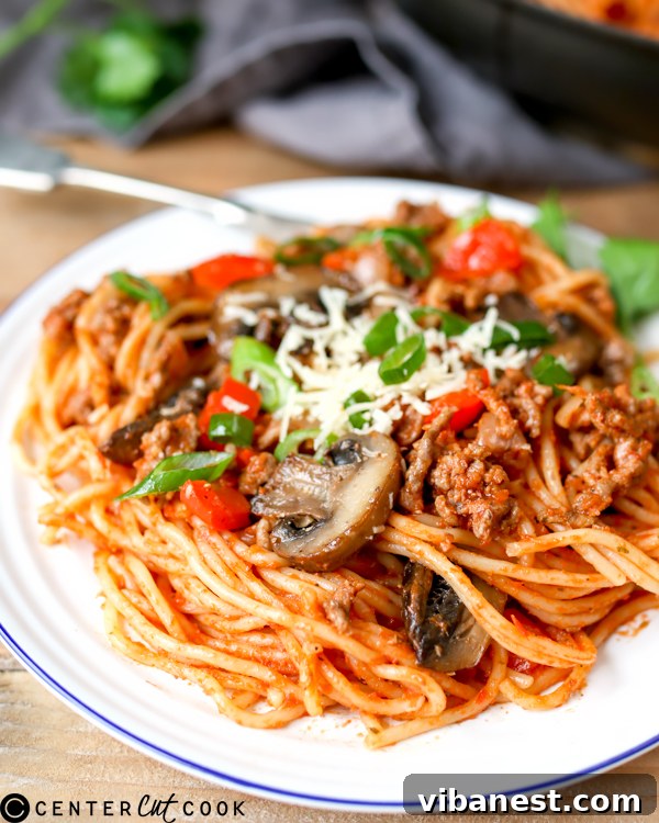 One-Pot Pasta Bolognese - Skillet View One-Pot Pasta Bolognese cooking in a large skillet, showcasing its simplicity