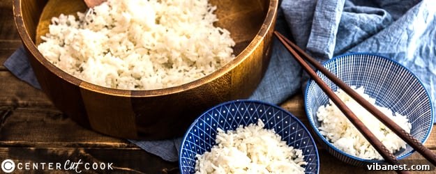 A bowl of perfectly cooked fluffy white rice, ready to be served.