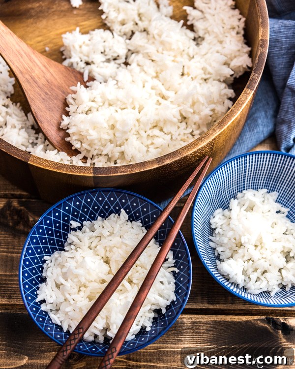 Close-up of fluffy white rice cooking in a Dutch oven, illustrating the perfect texture