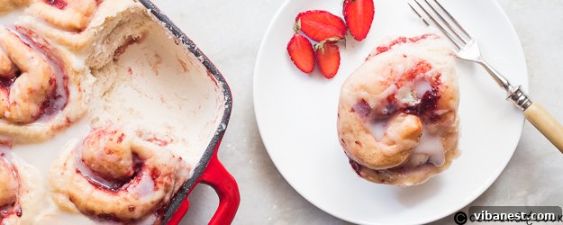 Delicious homemade strawberry rolls with a sweet rum glaze, served warm