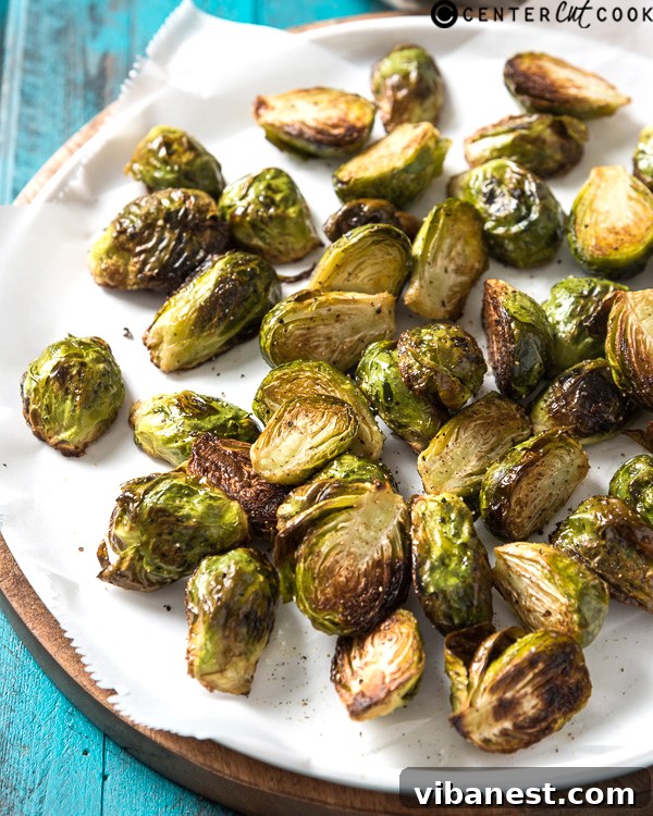 roasted-brussels-sprouts-2.jpg roasted brussels sprouts cooking on a sheet pan