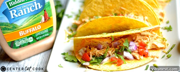 Delicious Slow Cooker Buffalo Ranch Chicken Tacos ready to serve with fresh toppings