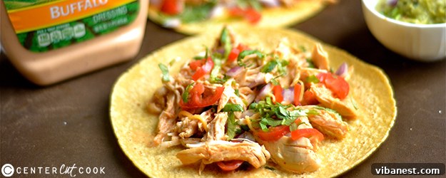 Close-up of shredded Buffalo Ranch Chicken Tacos filling in a slow cooker
