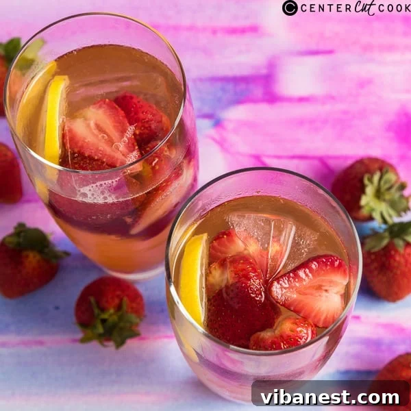 Glasses of homemade strawberry punch with lemon slices