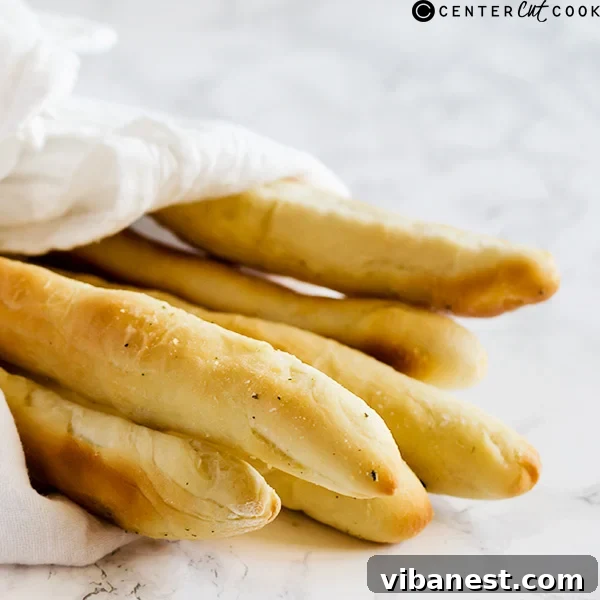 Garlic Butter Breadsticks Olive Garden Copycat Close-up of freshly baked garlic butter breadsticks, drizzled with butter and herbs