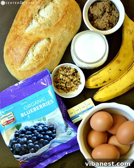 Close-up of baked Overnight Blueberry Banana French Toast, garnished with fresh berries