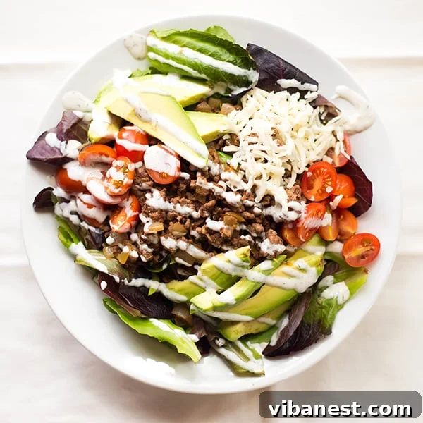 Taco salad ingredients beautifully arranged in a bowl