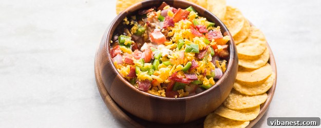 Delicious BBQ Bacon Ranch Dip served in a bowl, garnished with fresh herbs.
