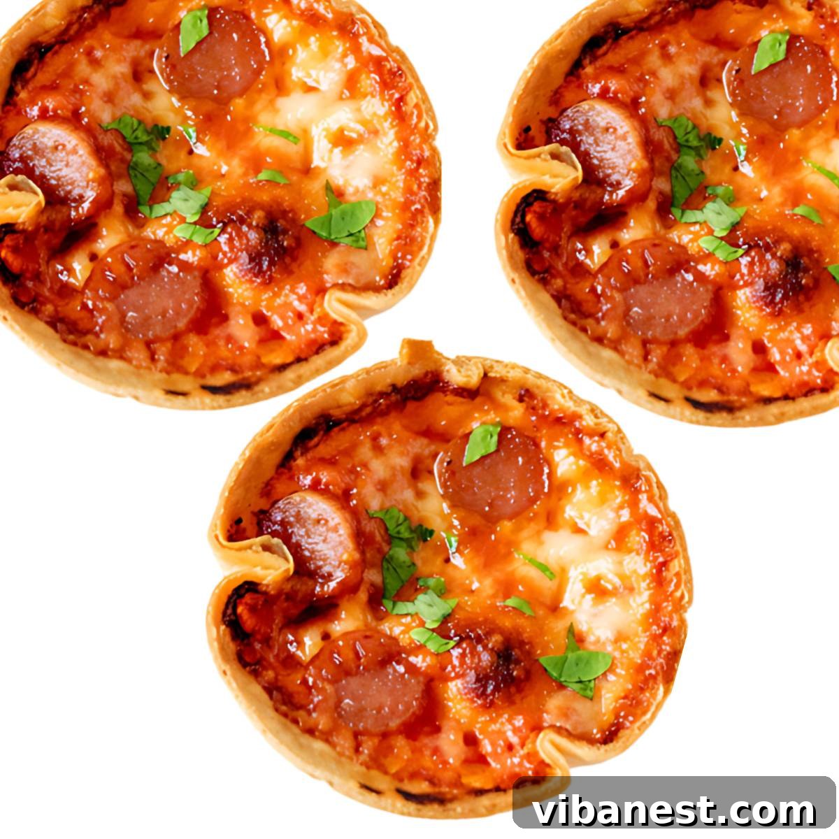 Cheesy Pizza Poppers 2 Crispy bite-sized pepperoni and cheese pizza snacks in a muffin tin