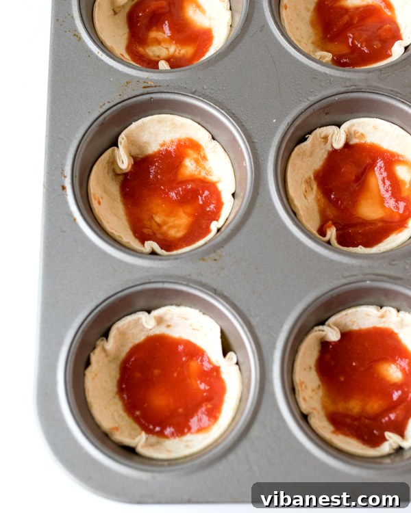pizza-bites-2.jpg Assorted pizza bites with various toppings, ready for baking