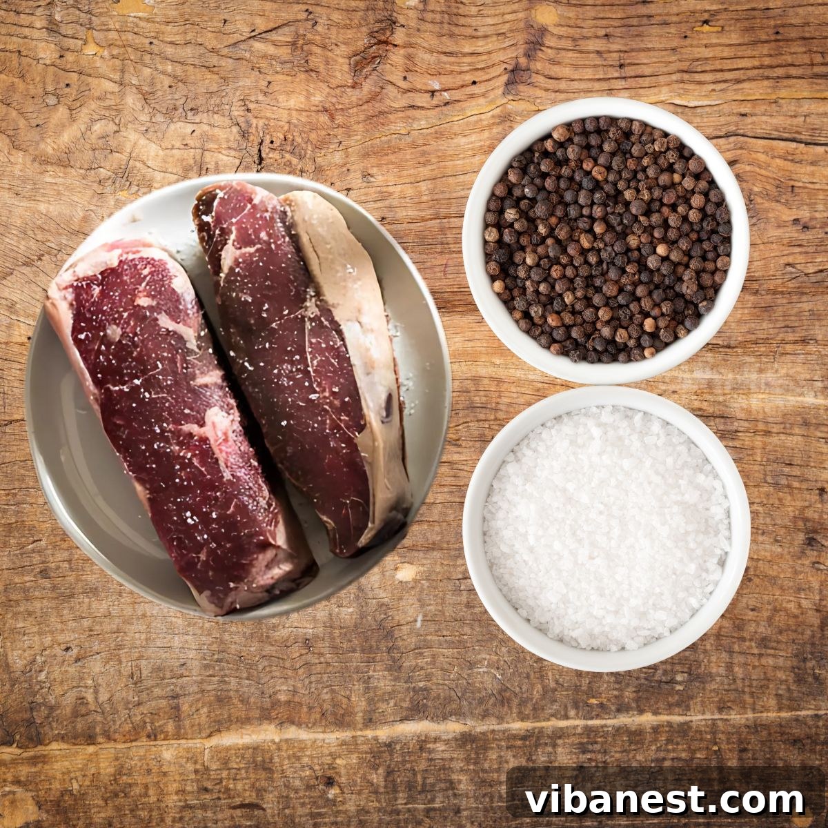 Signature Grilled Steak with Aromatic Butter 4 Ingredients for grilling steak: thick-cut steaks, salt, and pepper