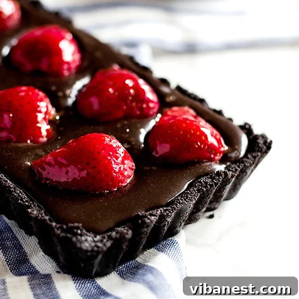 Finished chocolate strawberry tart ready to be served
