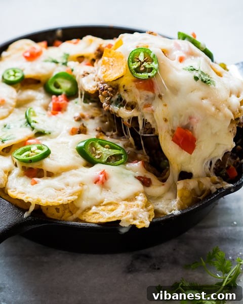 Close-up of Skillet Beef Taco Casserole with melted cheese and crispy chips