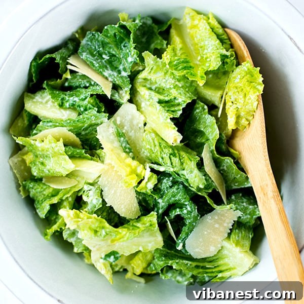 homemade-caesar-dressing-3.jpg Freshly tossed Caesar salad with homemade dressing, croutons, and parmesan