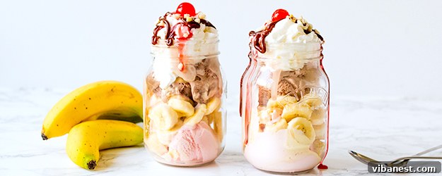 Delicious Mason Jar Banana Split with a variety of toppings, ready to be served