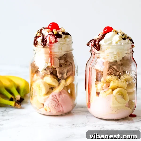 The finished Mason Jar Banana Split, perfectly assembled with all ingredients and toppings