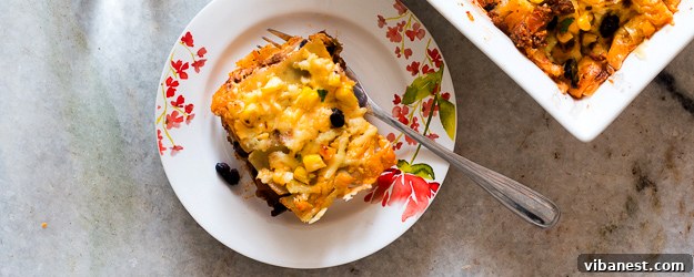 Delicious Cheesy Mexican Lasagna with layers of pasta, meat, and cheese