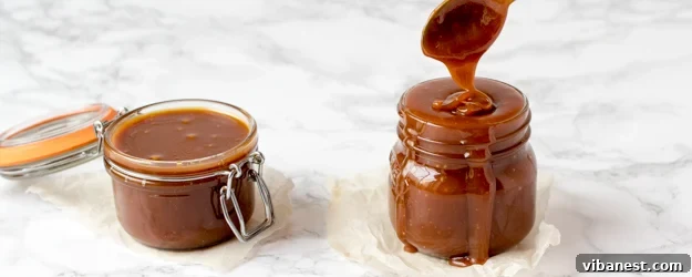 how-to-make-caramel-1.jpg Beautiful amber homemade caramel sauce cooling in a clear glass jar, ready for use