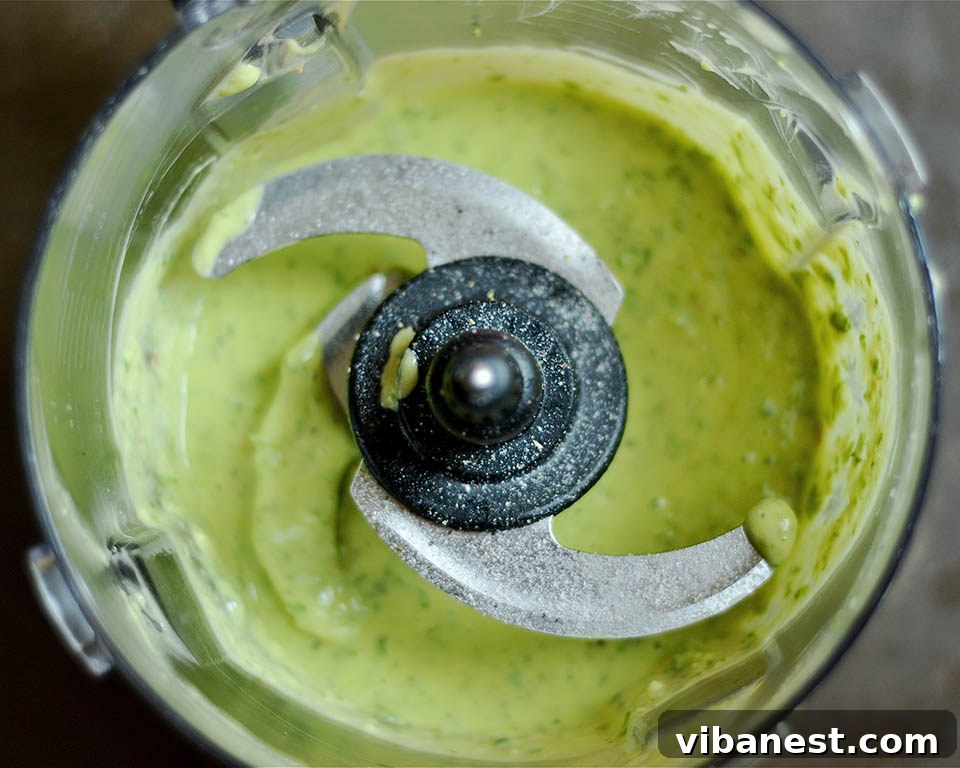 Avocado Pesto - A Healthy & Delicious Secret Fresh avocado being prepared for creamy pesto