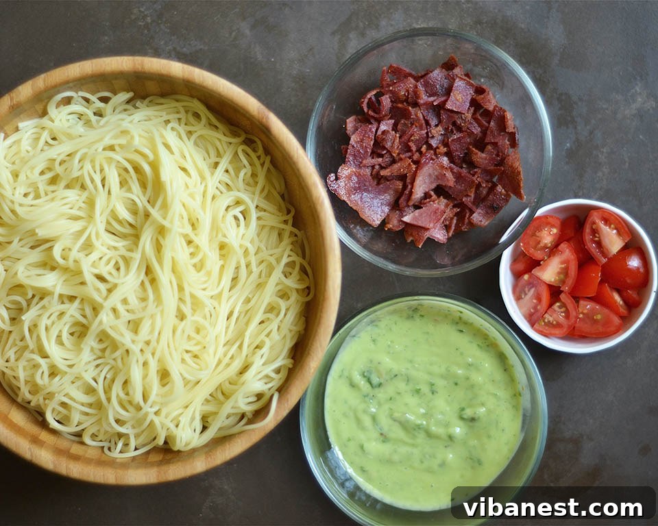 Simple Ingredients for a Quick Meal Close-up of fresh basil, avocado, and garlic for homemade pesto