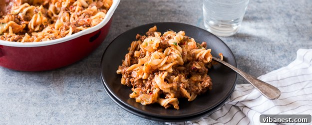 Delicious Skillet Cheeseburger Pasta Casserole, ready to serve with a garnish of pickles