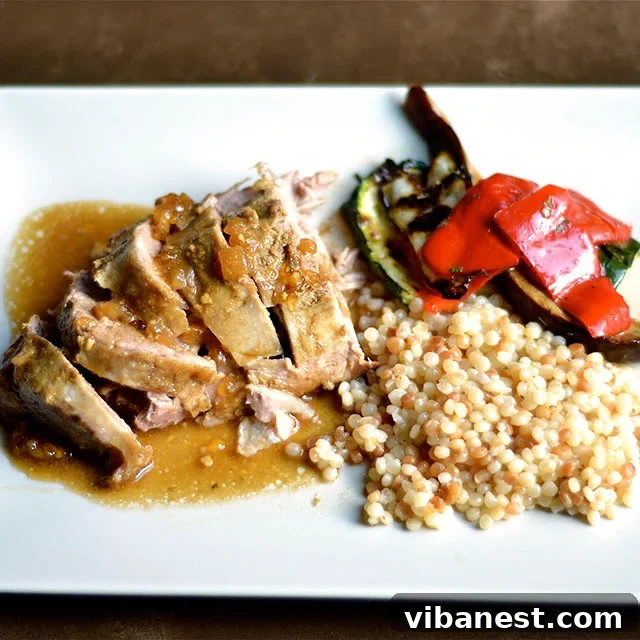 Slow Cooker Pork Tenderloin Meal Cooked Slow Cooker Pork Tenderloin with sauce and sides