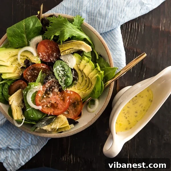 Mason jar filled with Olive Garden style salad dressing on a rustic wooden board
