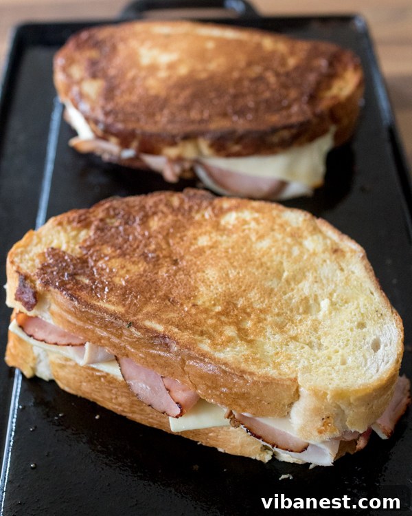 Monte Cristo Layers Close-up of a Monte Cristo sandwich, showing the layers of ham, turkey, and melted cheese