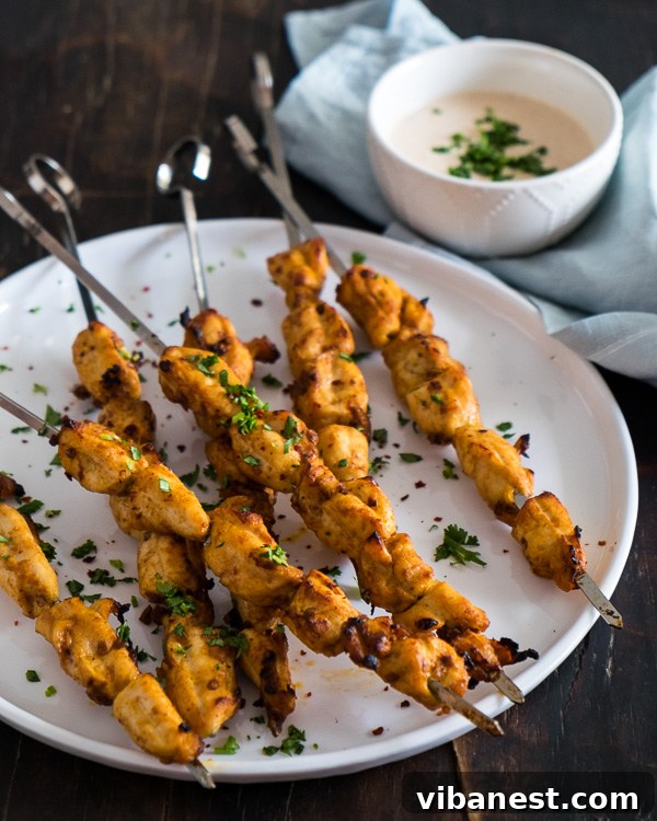 Chipotle Chicken Kabobs - Ready for the grill Chipotle chicken kabobs cooking on skewers