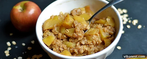 Delicious Instant Pot Apple Crisp with Vanilla Ice Cream Instant Pot Apple Crisp in a serving dish with ice cream