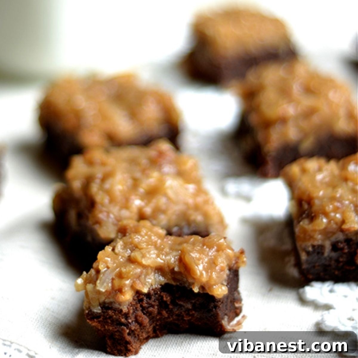 Coconut Pecan Chocolate Brownie Bliss 2 Close-up of irresistibly fudgy German chocolate brownies, showcasing their rich texture and delectable coconut-pecan topping.