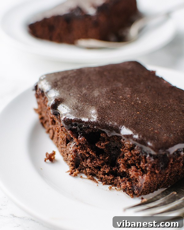Close-up of a perfectly baked Coca-Cola cake with generous frosting