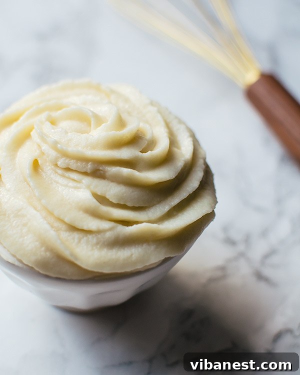 how-to-make-vanilla-frosting-2.jpg Vanilla Frosting being prepared in a mixer
