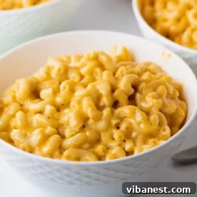 Top-Tier Thanksgiving Side Dishes 8 A bowl of incredibly creamy Instant Pot macaroni and cheese, topped with fresh parsley, an easy and comforting holiday side.