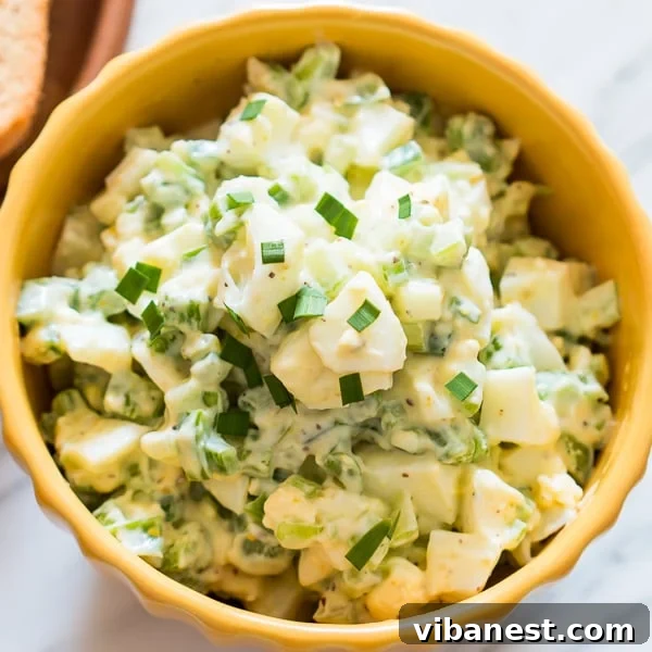 Close-up of freshly prepared green bell pepper egg salad in a bowl