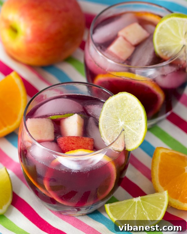 sangria-fruit-prep Close-up of fresh fruit slices (orange, lime, lemon) neatly arranged for sangria preparation