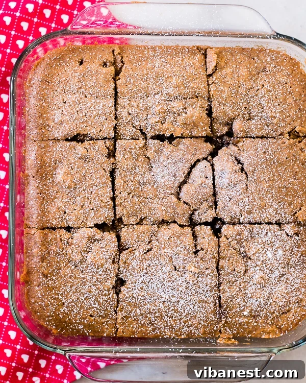 Spiced Applesauce Cake - Ready to Serve Spiced applesauce cake squares with drizzle
