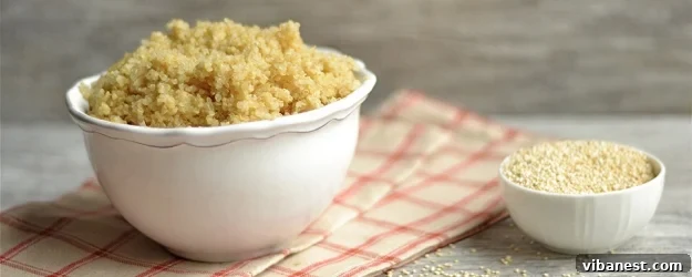 Delicious and Healthy Quinoa Recipe A bowl of fluffy cooked quinoa, garnished with fresh herbs, ready to be served.