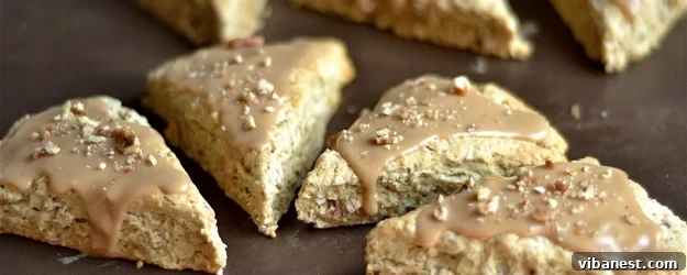 Delicious Maple Oat Pecan Scones with a creamy maple glaze, perfect for a cozy breakfast