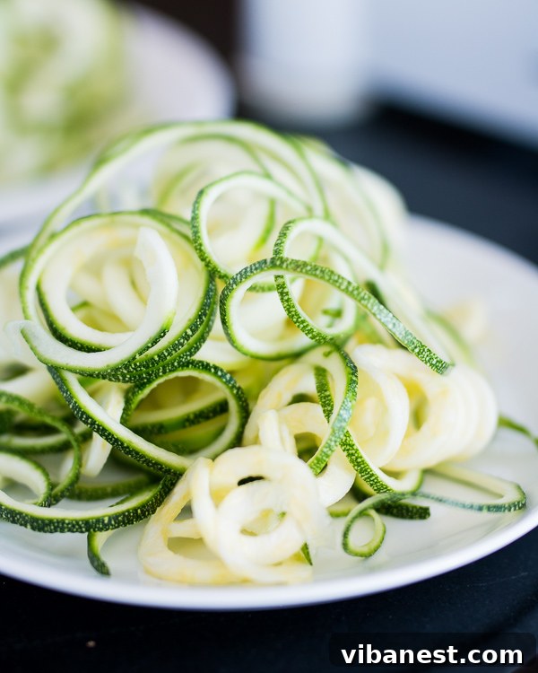 Bowl of Freshly Made Zucchini Noodles Freshly spiraled zucchini noodles in a bowl