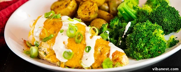 Baked Ranch Chicken Closer Look A close-up of cheesy, baked ranch chicken, perfectly cooked and golden brown.