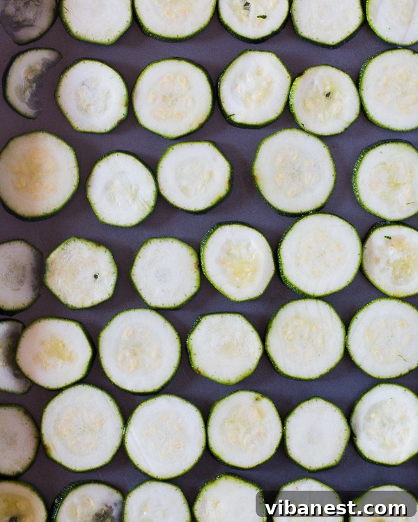 baked-zucchini-chips-2.jpg Freshly baked golden zucchini chips on a cooling rack