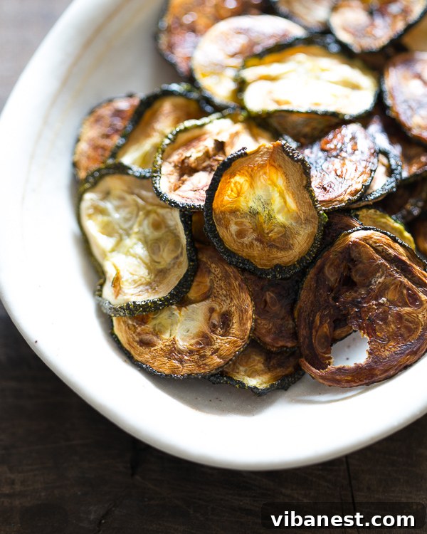baked-zucchini-chips-3.jpg Delicious seasoned zucchini chips ready to be baked