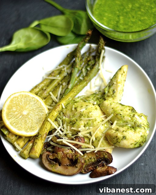 one-pan-baked-pesto-chicken-veggies-2.jpg Close-up of One-Pan Baked Pesto Chicken with Roasted Asparagus and Mushrooms