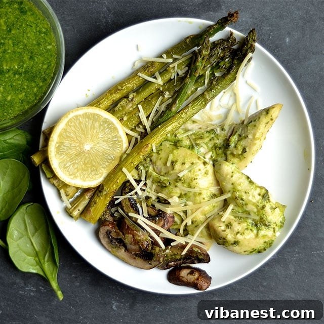 one-pan-baked-pesto-chicken-veggies-3.jpg Pesto Chicken and Veggies ready to serve with pasta