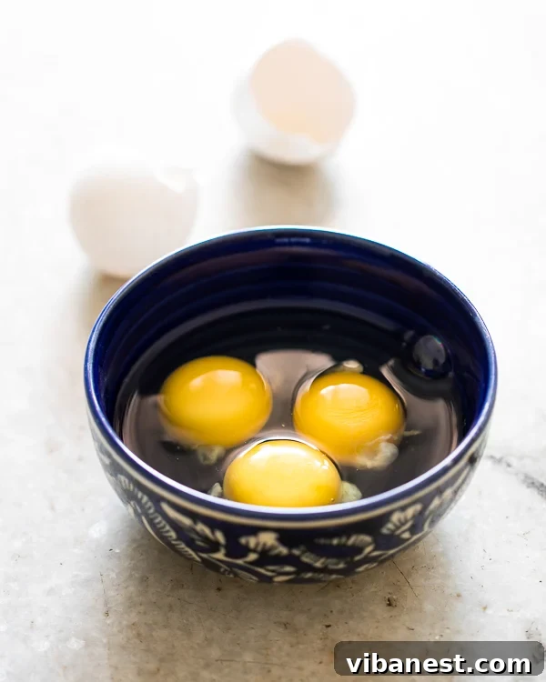 How to make an omelet: The crucial initial stage Omelet cooking in a non-stick pan, showing initial set