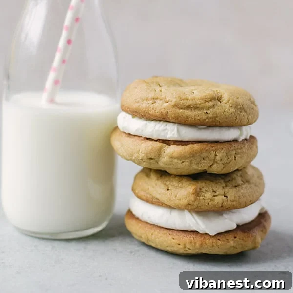 Stacked Fluffernutter Cookies showing creamy marshmallow filling